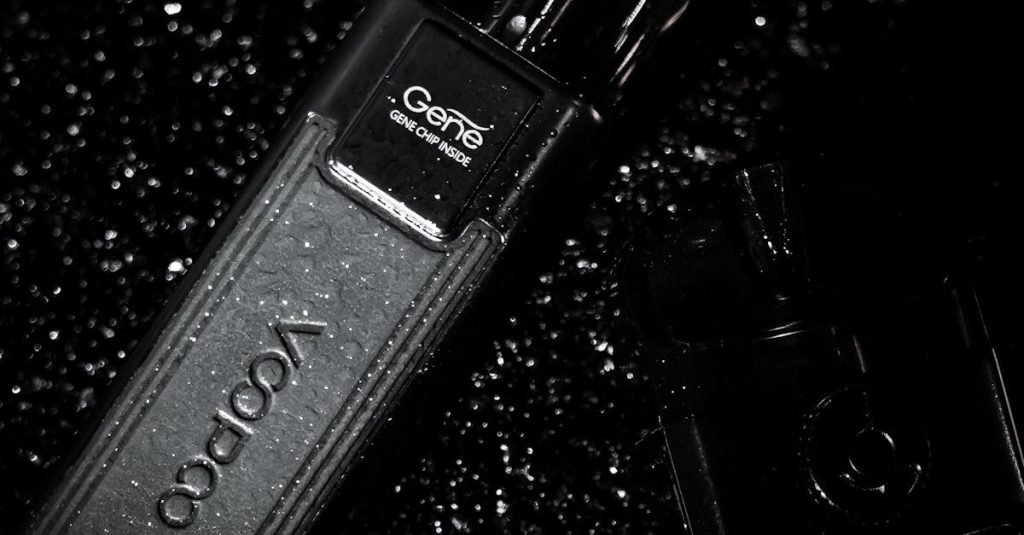 Artistic black and white photo of a vape in a leather case with water droplets.